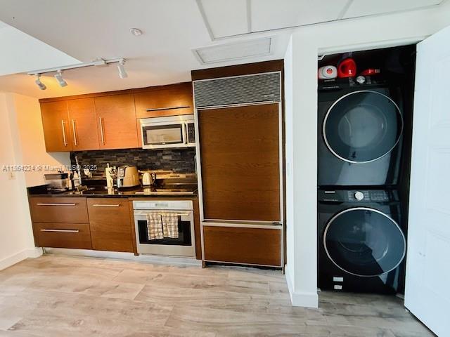 475 Brickell Avenue, Unit 4910 Miami, FL 33131 - Photo 2 of 42 a kitchen with a refrigerator and a sink