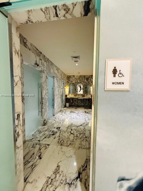 475 Brickell Avenue, Unit 4910 Miami, FL 33131 - Photo 26 of 42 a bathroom with a bathtub and shower