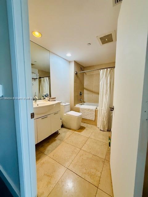 475 Brickell Avenue, Unit 4910 Miami, FL 33131 - Photo 3 of 42 a bathroom with a sink mirror and vanity