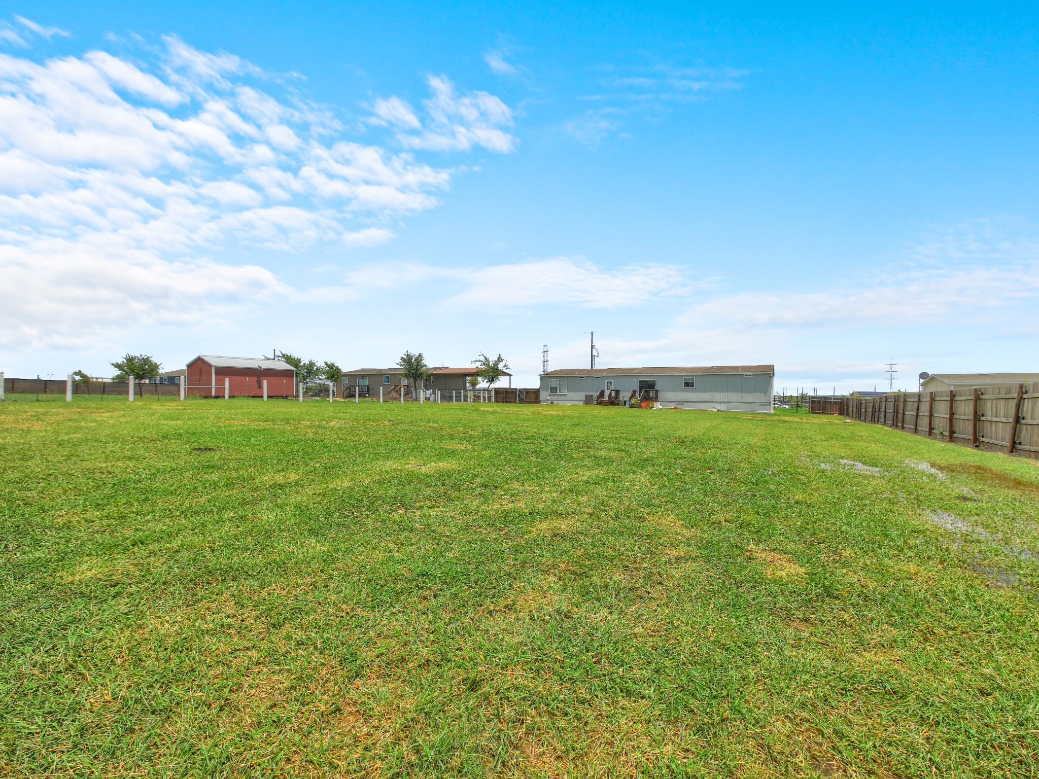 271 Alma Lane Kyle, TX 78640 - Photo 21 of 25 a view of a green field with clear sky