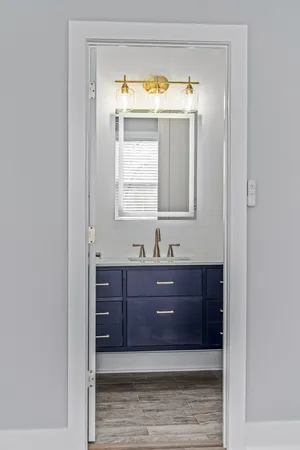 a bathroom with a vanity and a mirror