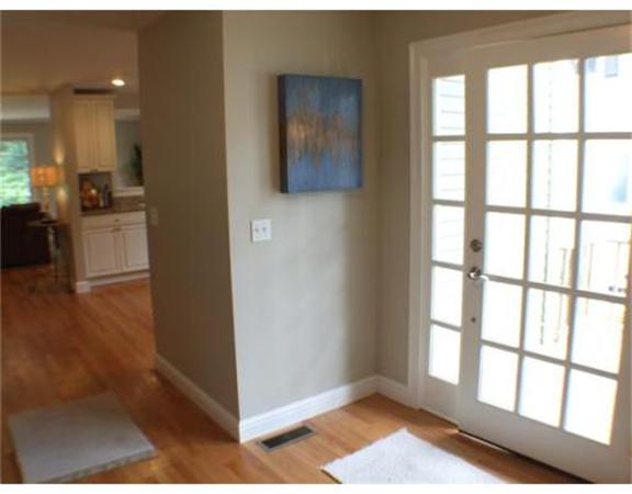 33 Tanglewood Road, Unit 1 Newton, MA 02459 - Photo 6 of 29 a view of hallway with window and wooden floor