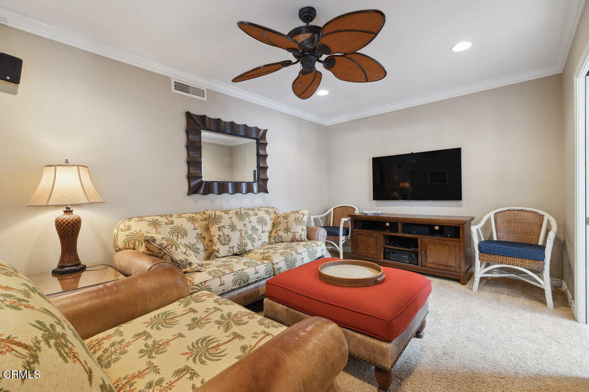 2231 Peninsula Road Oxnard, CA 93035 - Photo 18 of 40 a living room with furniture ceiling fan and a rug