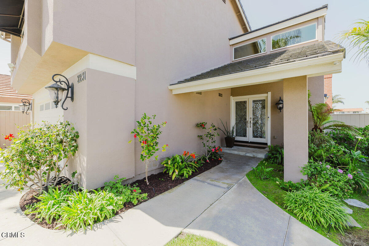2231 Peninsula Road Oxnard, CA 93035 - Photo 3 of 40 a front view of a house with a yard
