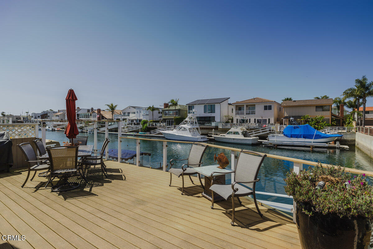 2231 Peninsula Road Oxnard, CA 93035 - Photo 32 of 40 a view of a chairs and table on the deck