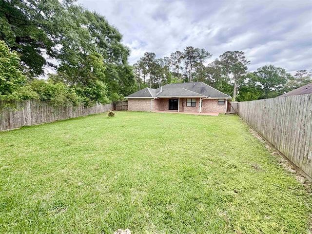 127 Timbercreek Lane Lumberton, TX 77657 - Photo 29 of 30 a view of a house with a yard