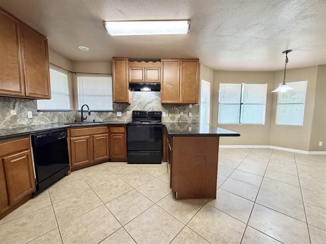 127 Timbercreek Lane Lumberton, TX 77657 - Photo 8 of 30 a kitchen with stainless steel appliances granite countertop a stove a sink and a refrigerator