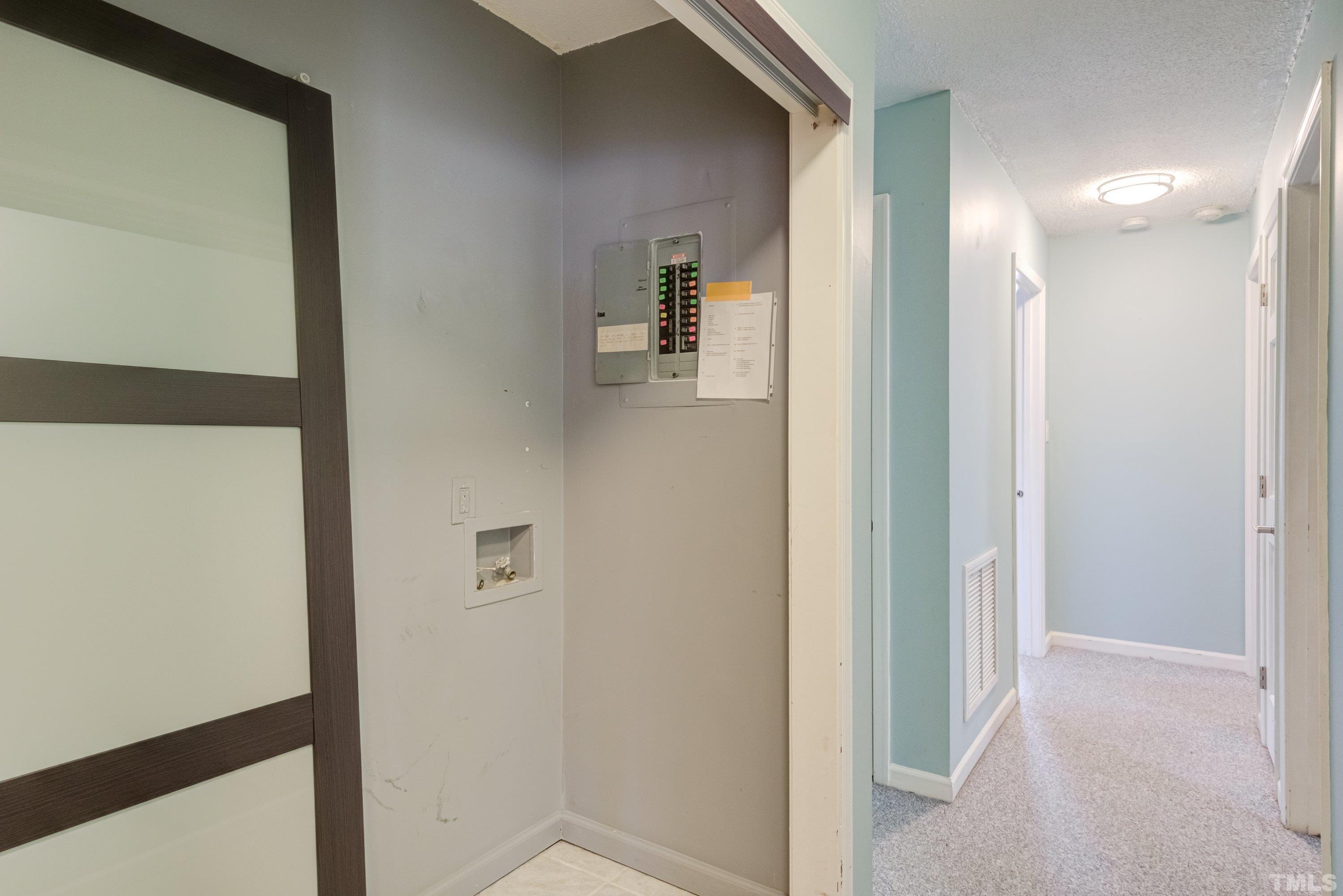 7008 Ray Road Raleigh, NC 27613 - Photo 11 of 36 a view of a hallway with wooden floor