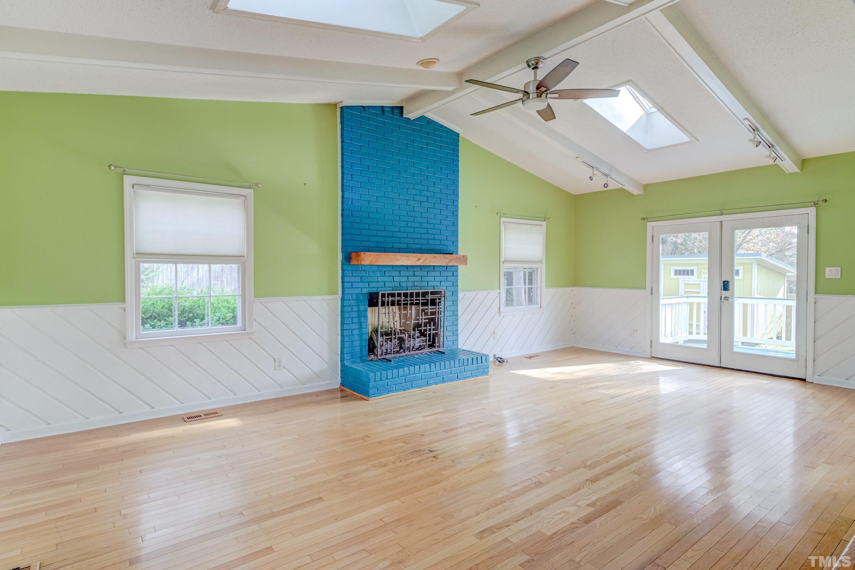 7008 Ray Road Raleigh, NC 27613 - Photo 15 of 36 a view of empty room with wooden floor and fan