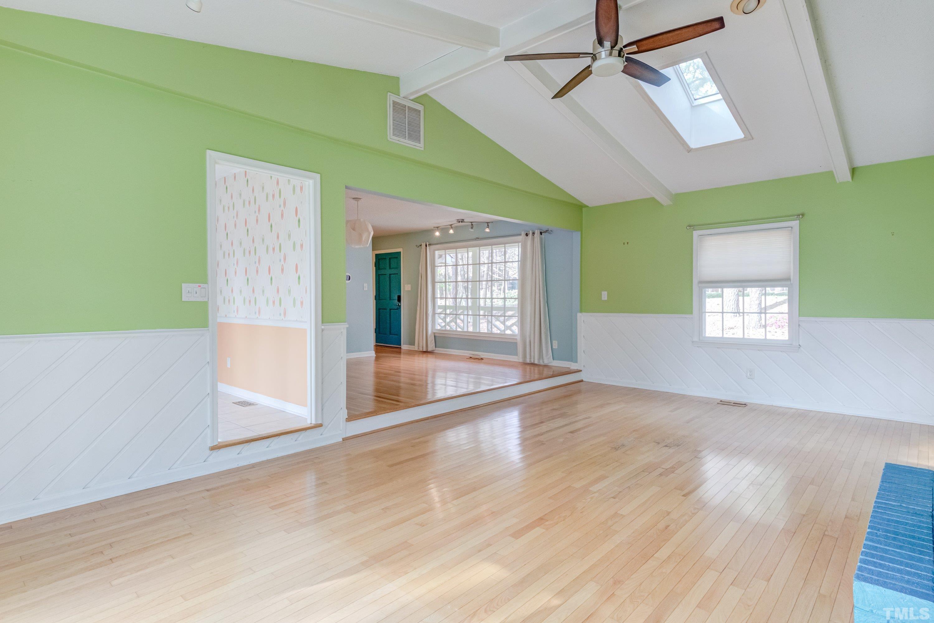7008 Ray Road Raleigh, NC 27613 - Photo 16 of 36 wooden floor in an empty room with a window