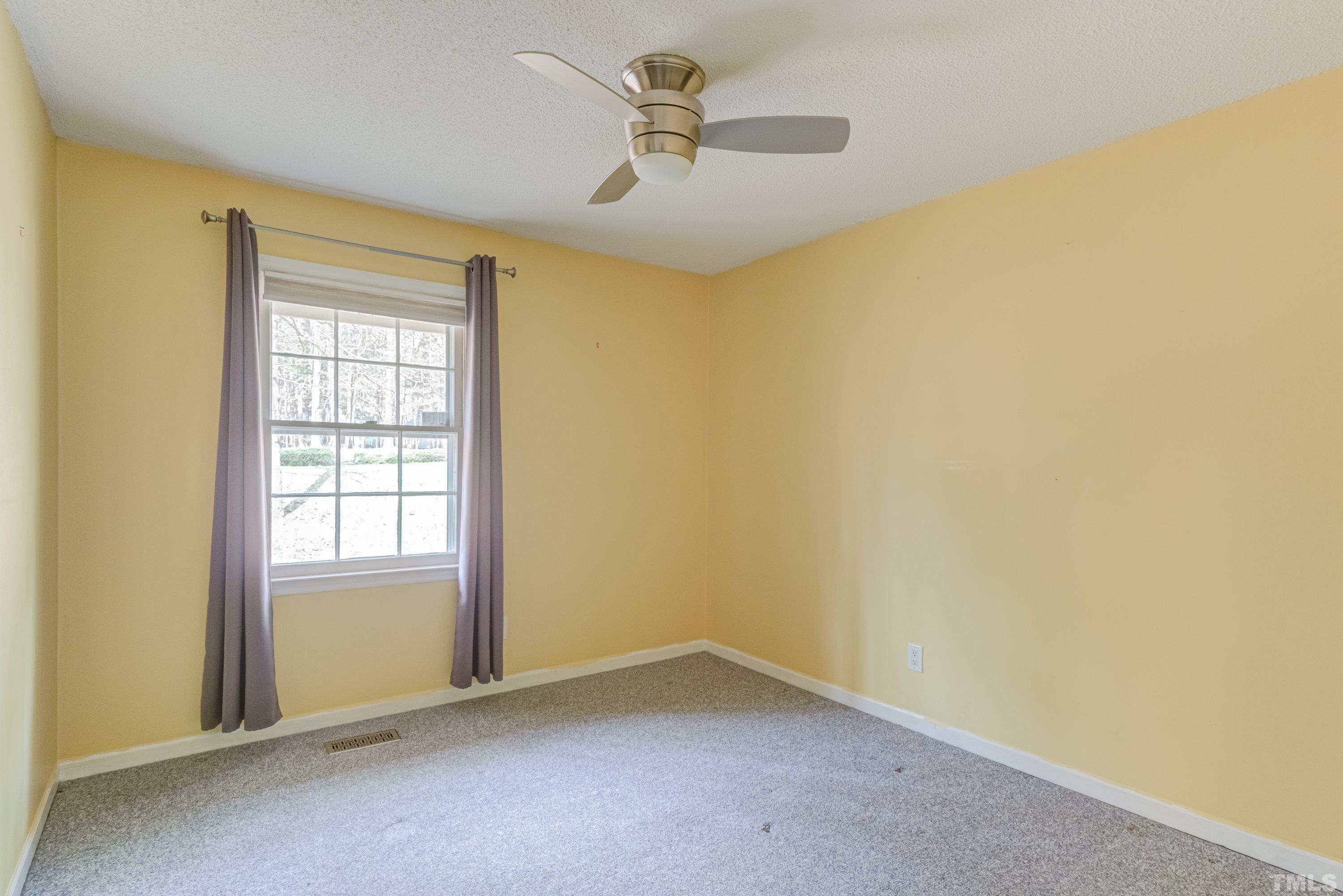 7008 Ray Road Raleigh, NC 27613 - Photo 18 of 36 an empty room with a window