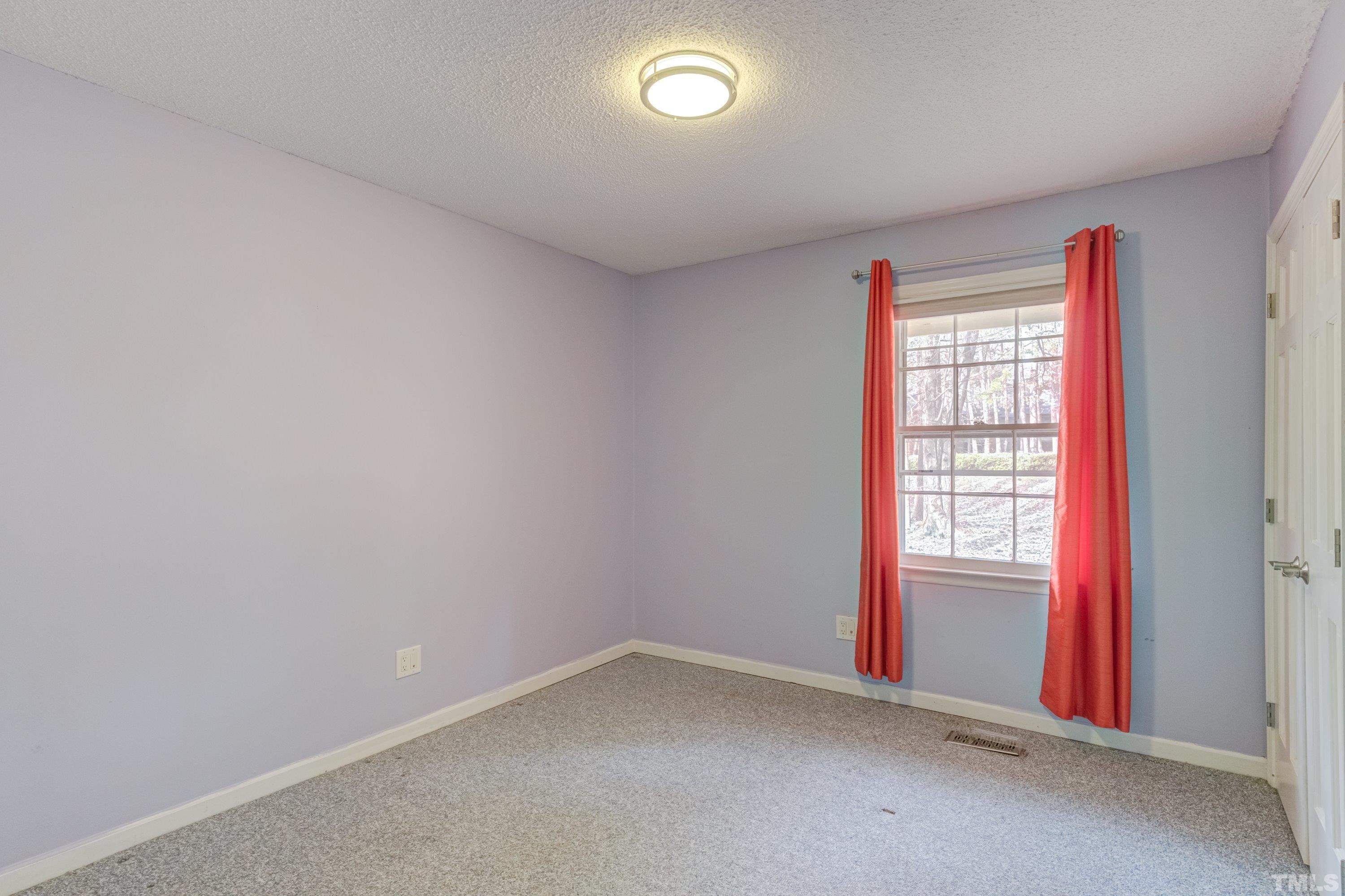 7008 Ray Road Raleigh, NC 27613 - Photo 23 of 36 an empty room with a window