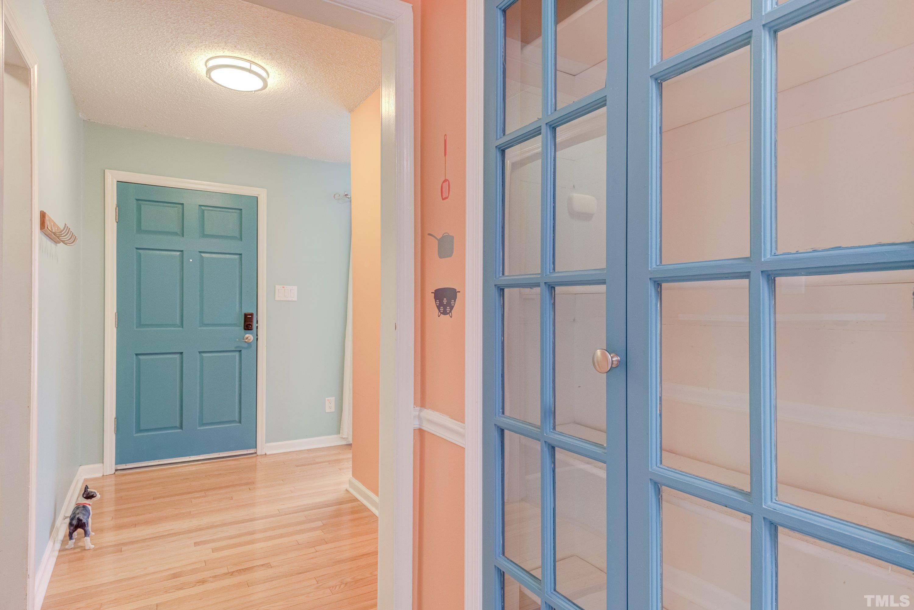 7008 Ray Road Raleigh, NC 27613 - Photo 9 of 36 a view of an empty room with wooden floor and a window