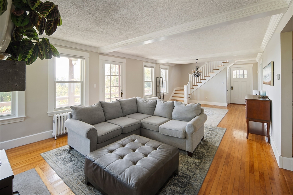 20 Mountain Road Princeton, MA 01541 - Photo 4 of 17 a living room with furniture a chandelier and a rug