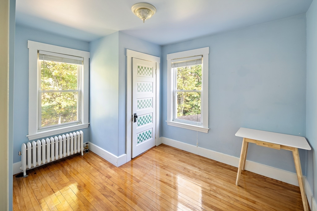 20 Mountain Road Princeton, MA 01541 - Photo 9 of 17 a view of an empty room with a window and wooden floor