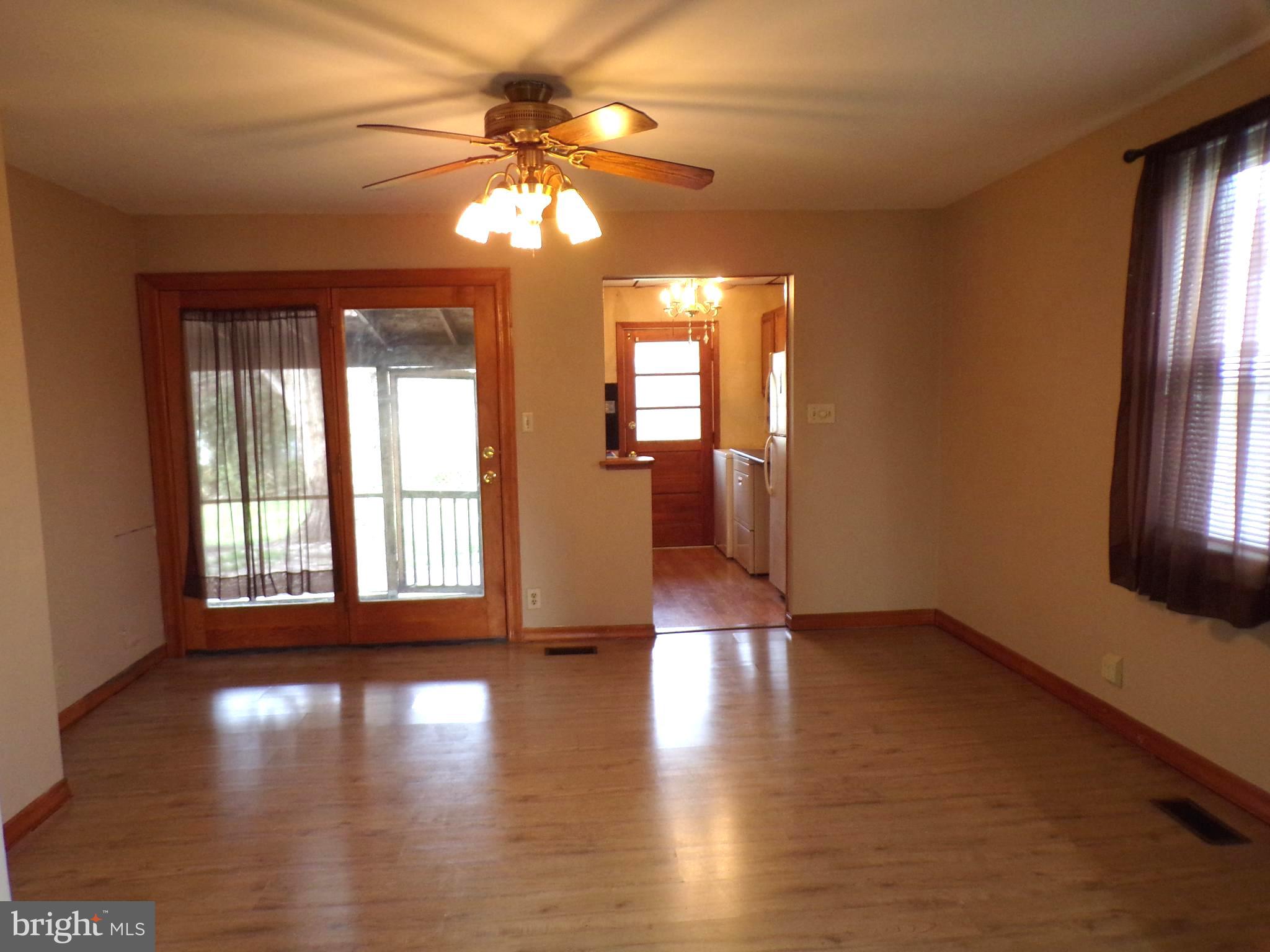 3404 Sollers Point Road Baltimore, MD 21222 - Photo 9 of 28 Dining Room With Screened In Porch In Background
