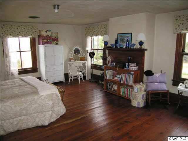22194 Mitchell Ford Road Lignum, VA 22726 - Photo 9 of 14 The second floor includes a large center hall as well and five bedrooms, including this example.