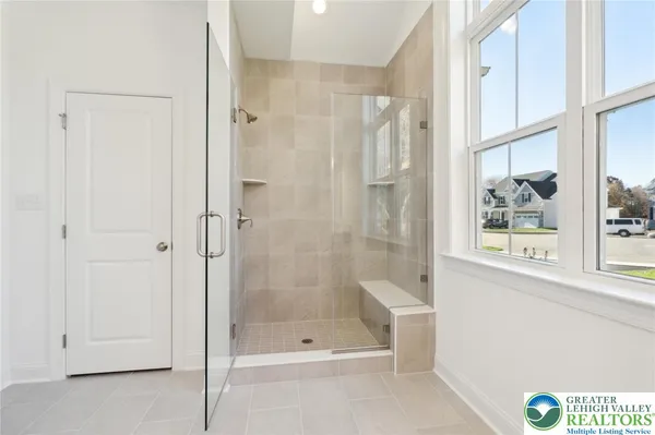 a bathroom with a bathtub and a shower
