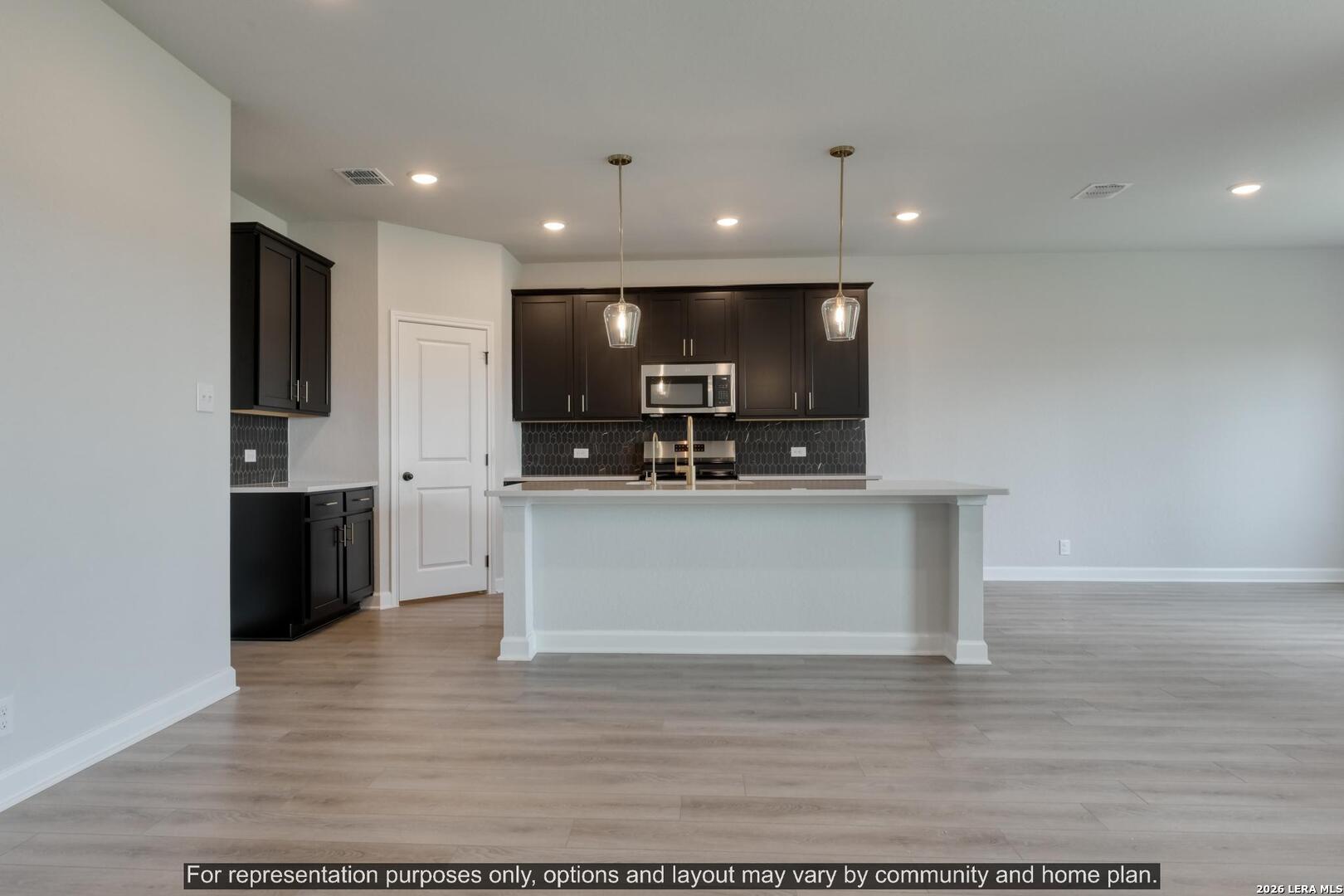 145 Yale Street Seguin, TX 78155 - Photo 12 of 24 a view of kitchen with stainless steel appliances kitchen island sink and refrigerator