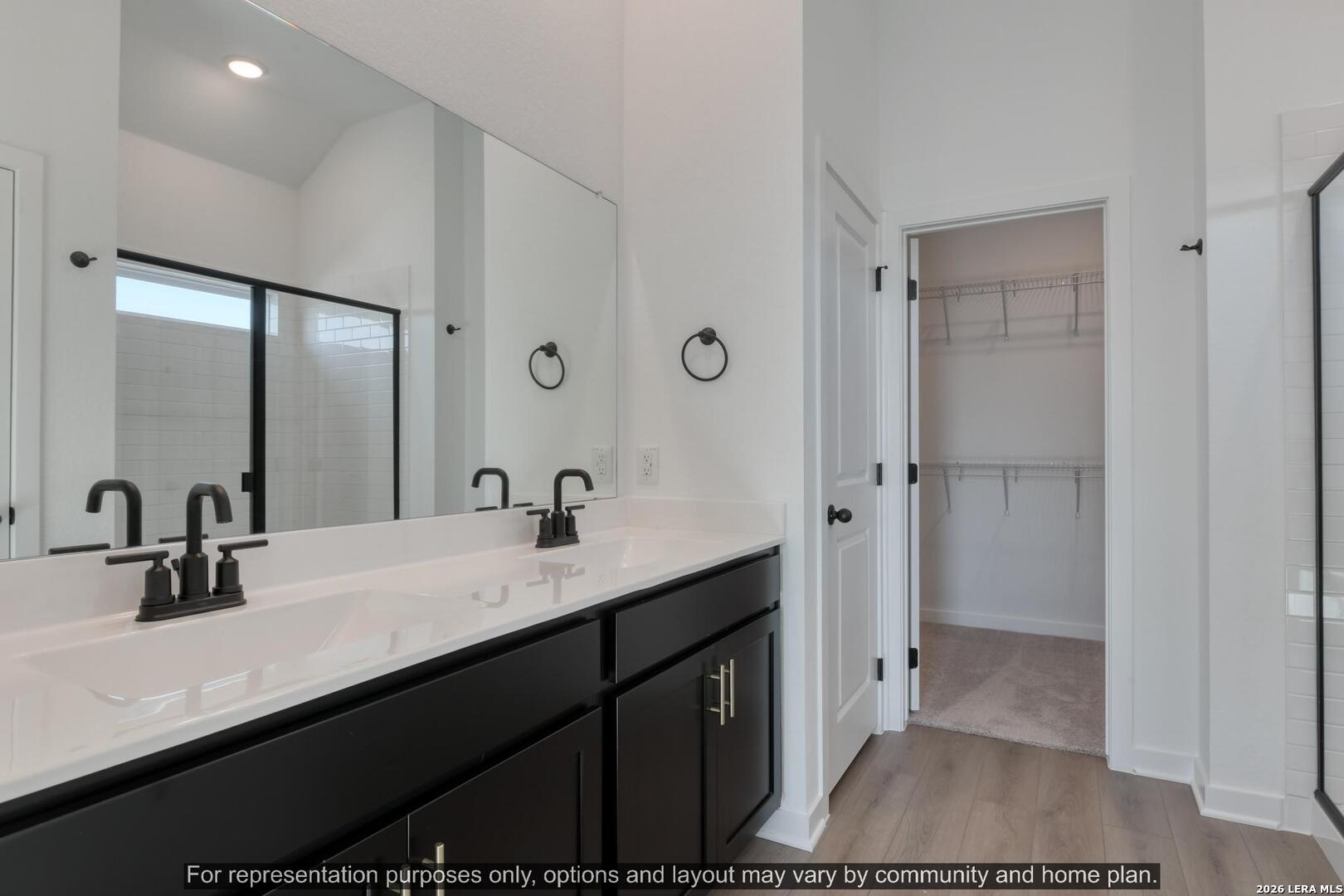 145 Yale Street Seguin, TX 78155 - Photo 20 of 24 a en suite bathroom with a sink a mirror and a shower