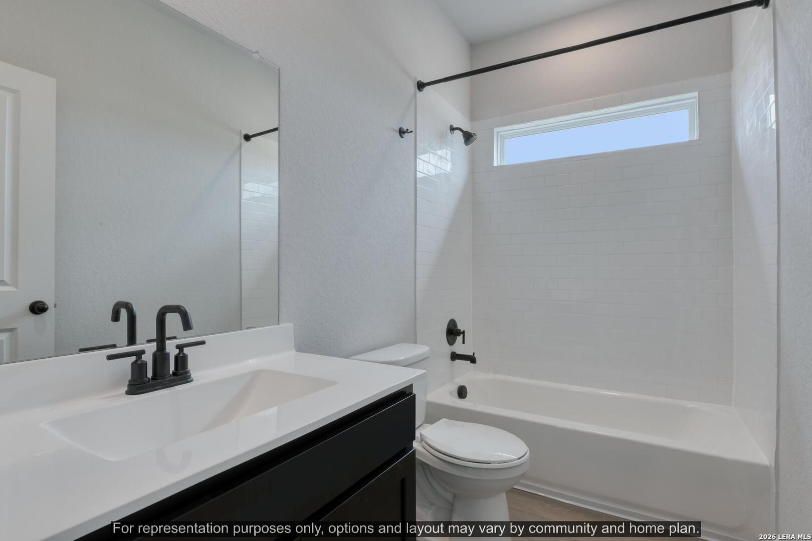 145 Yale Street Seguin, TX 78155 - Photo 24 of 24 a bathroom with a sink a toilet a mirror a bathtub and shower