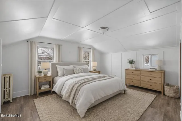 a bed room with a bed and a window