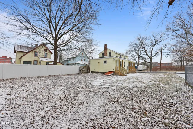 a view of a house with a back yard