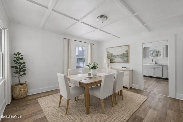 a dining room with furniture and window