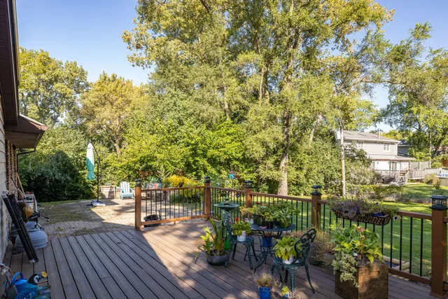 a view of a balcony with wooden floor