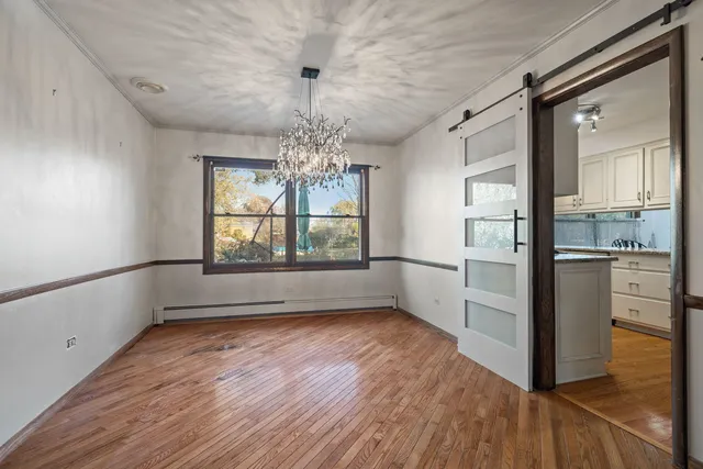 a view of a kitchen with a dishwasher cabinets and wooden floor