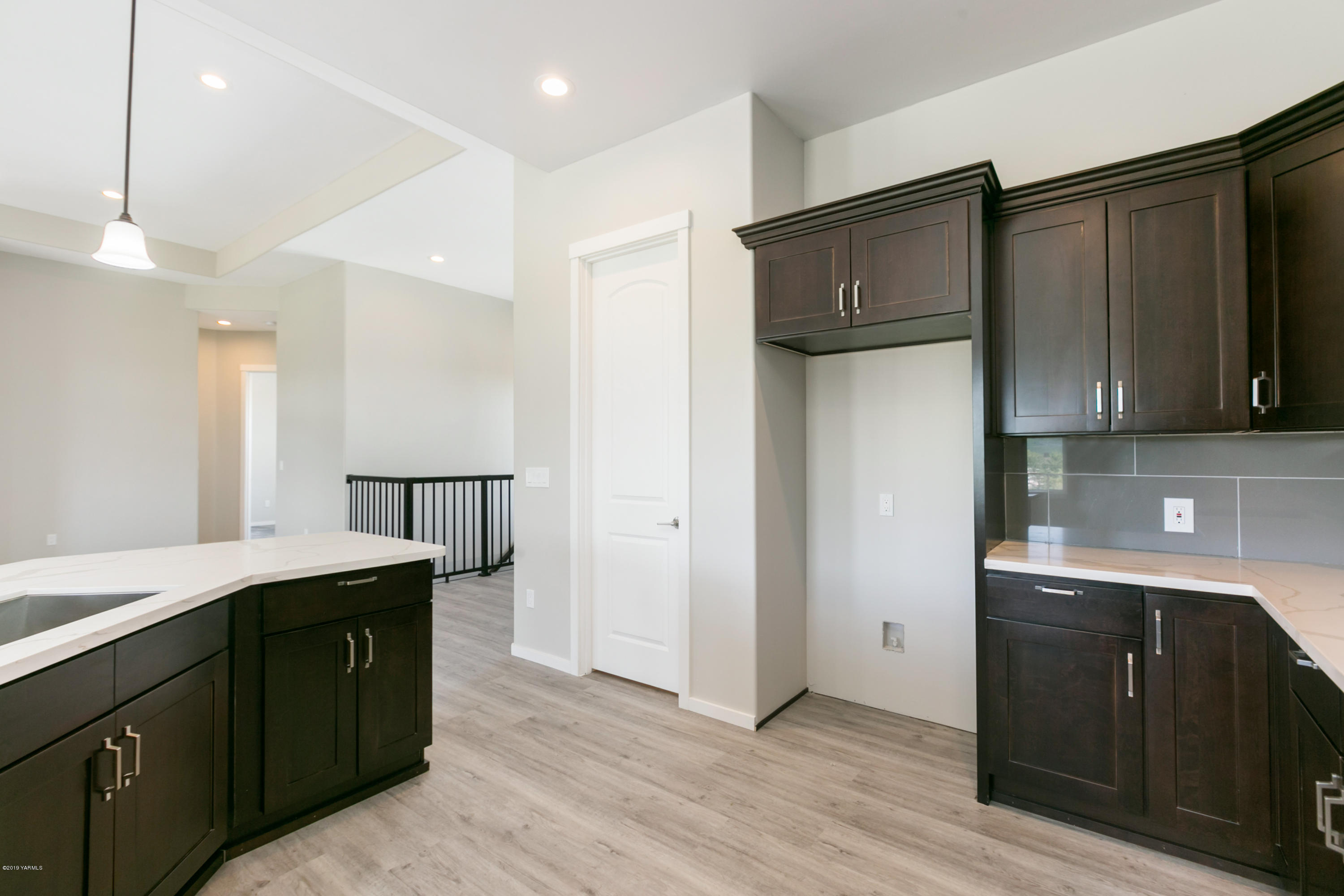 640 Winchester Road Yakima, WA 98908 - Photo 8 of 26 a kitchen with stainless steel appliances granite countertop a refrigerator a sink and a microwave