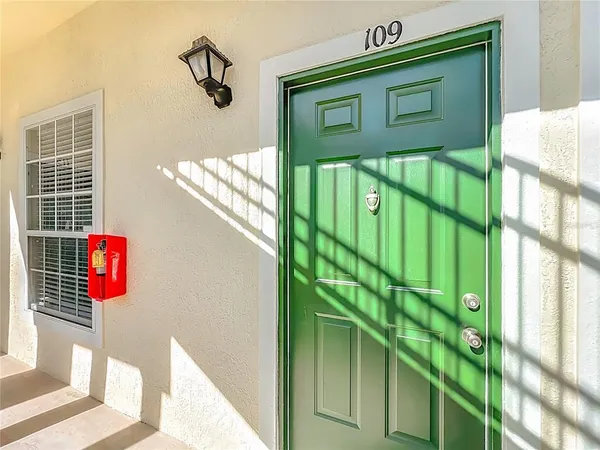 a bathroom with a window and a shower