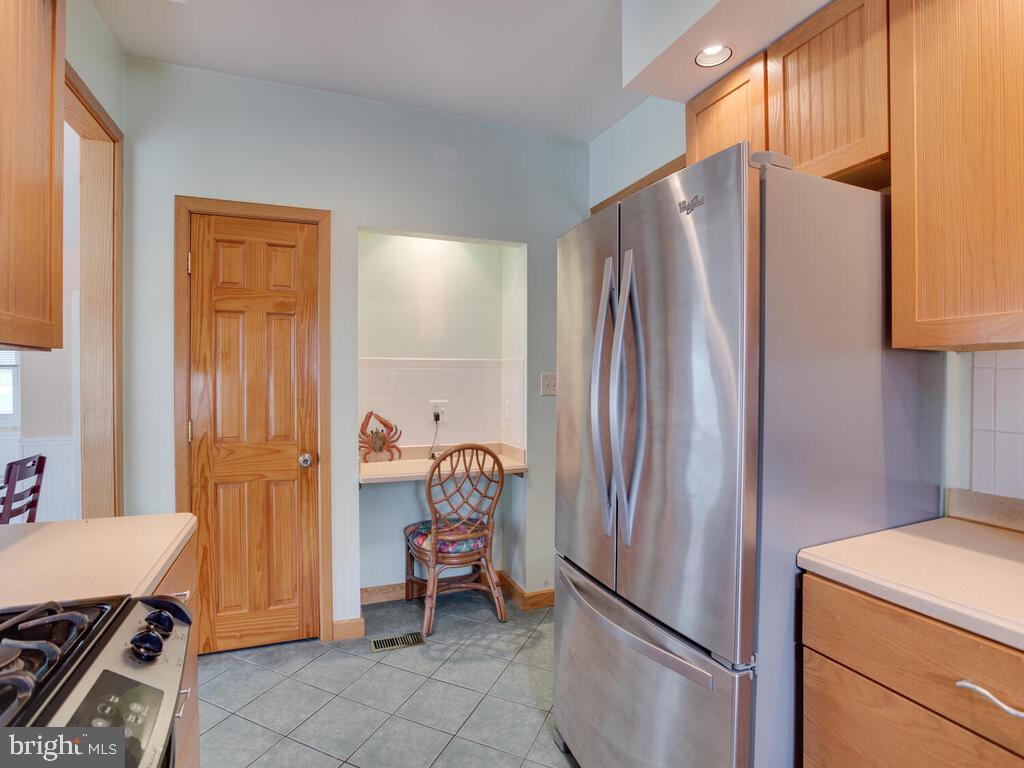 3208 Burgess Road Chesapeake Beach, MD 20732 - Photo 15 of 64 Kitchen has a pantry closet and desk area