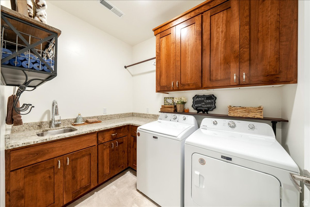 357 East Main Street Enterprise, UT 84725 - Photo 41 of 71 Laundry area featuring washing machine and dryer and cabinet space