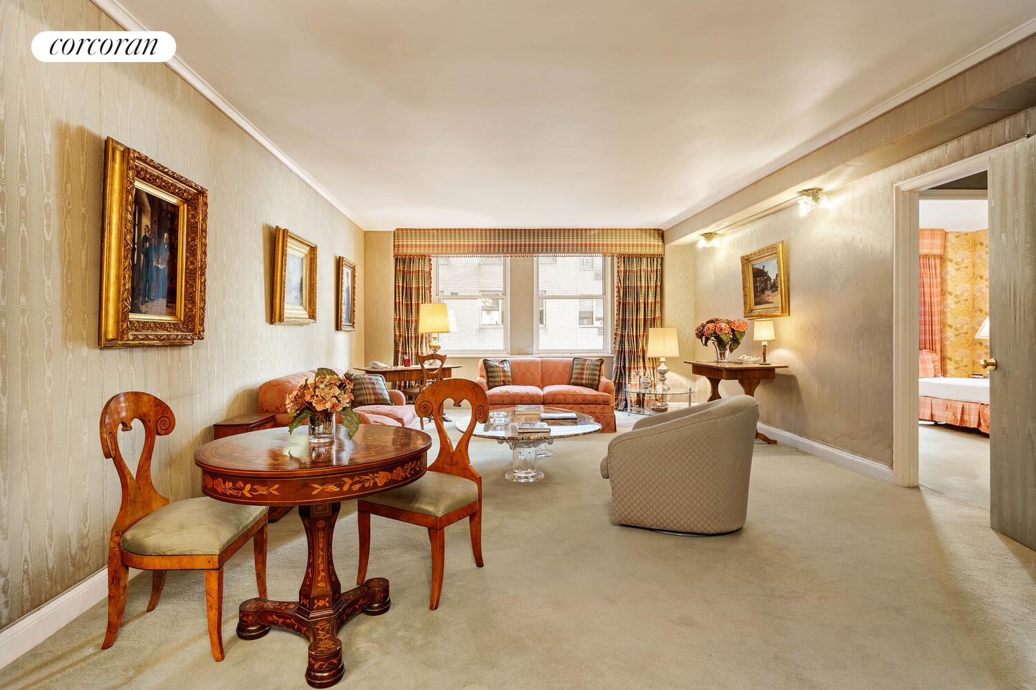 111 East 56th Street, Unit 1107 Manhattan, NY 10022 - Photo 2 of 6 a living room with furniture and a large window