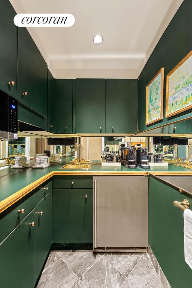 111 East 56th Street, Unit 1107 Manhattan, NY 10022 - Photo 5 of 6 a kitchen with a sink and cabinets