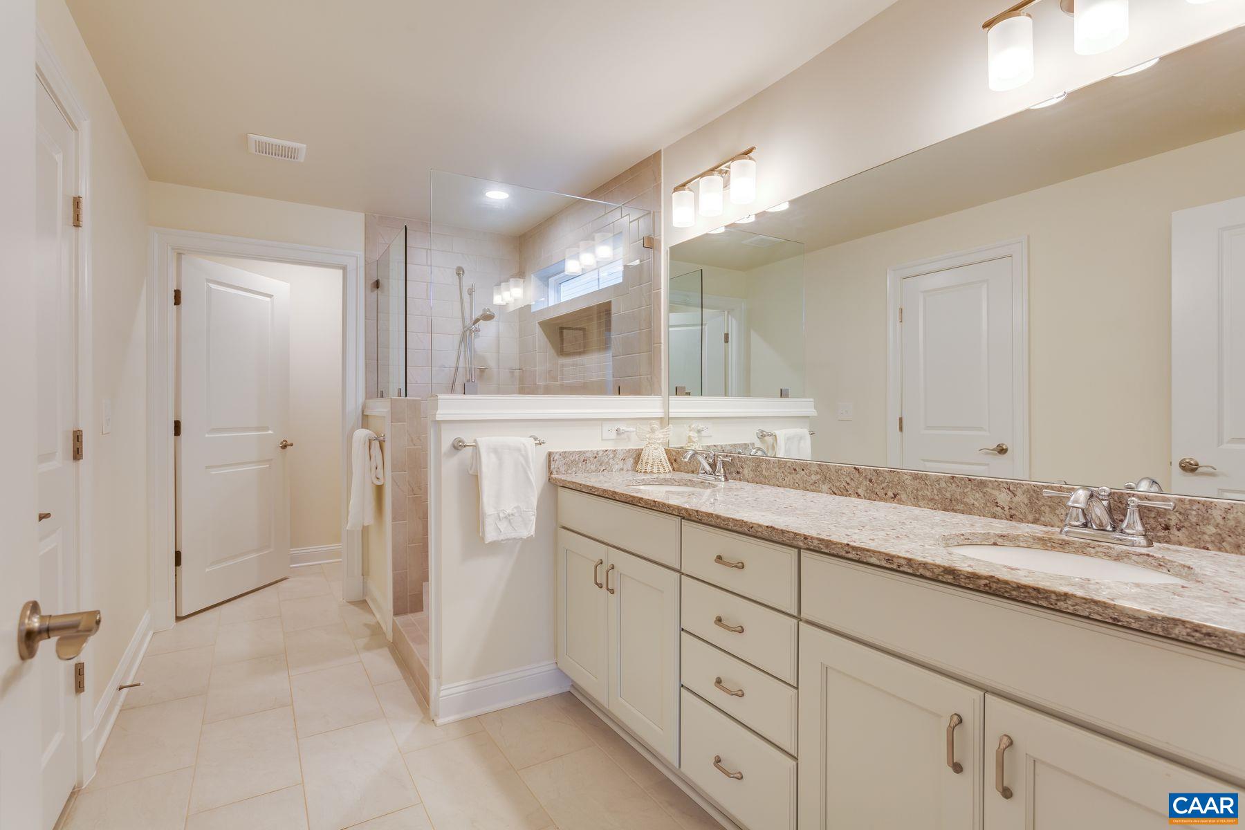 1927 Fowler Street Charlottesville, VA 22901 - Photo 11 of 36 a bathroom with a granite countertop sink mirror and double