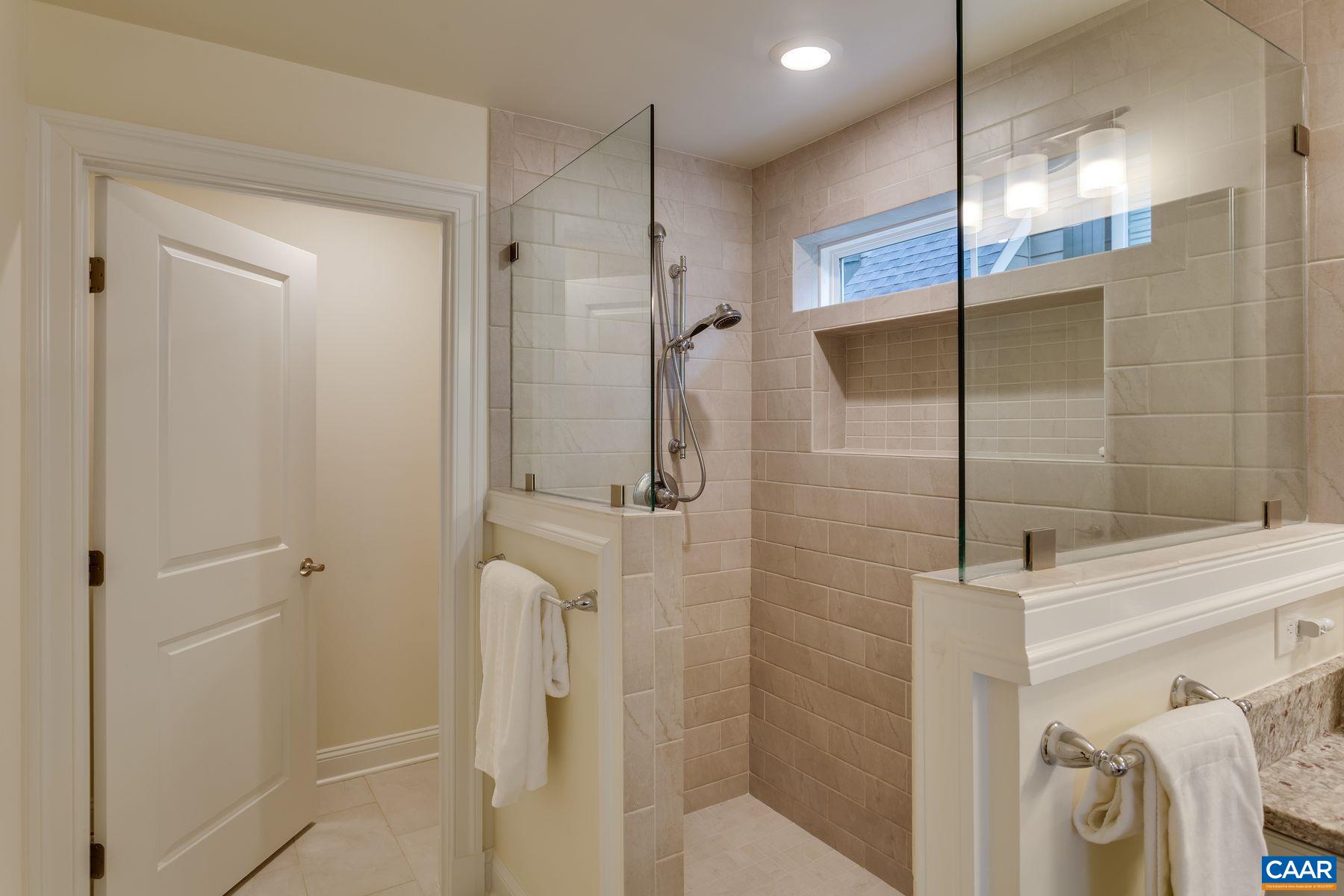 1927 Fowler Street Charlottesville, VA 22901 - Photo 12 of 36 a bathroom with a shower and a glass door