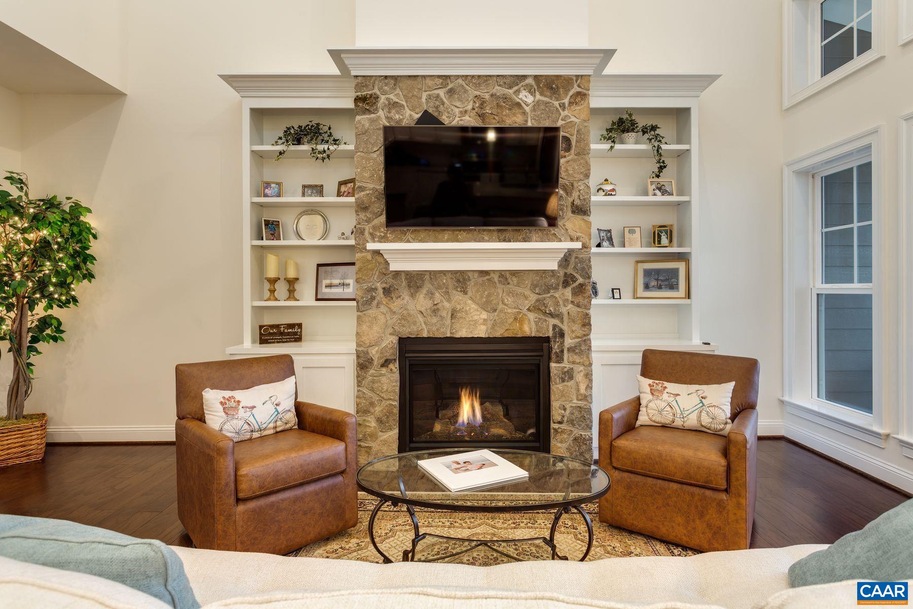 1927 Fowler Street Charlottesville, VA 22901 - Photo 16 of 36 a living room with furniture and a fireplace