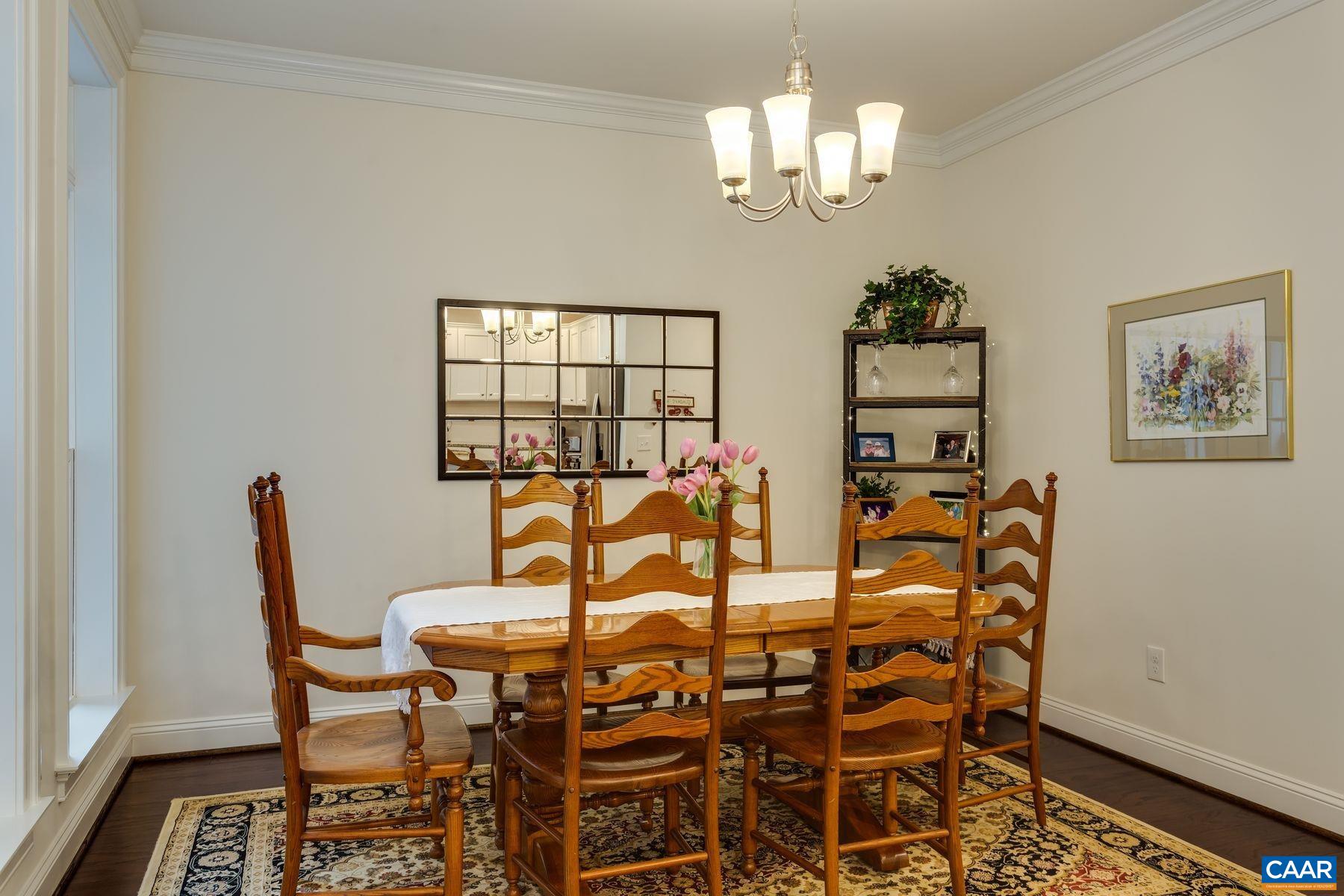 1927 Fowler Street Charlottesville, VA 22901 - Photo 22 of 36 a view of a dining room with furniture and chandelier