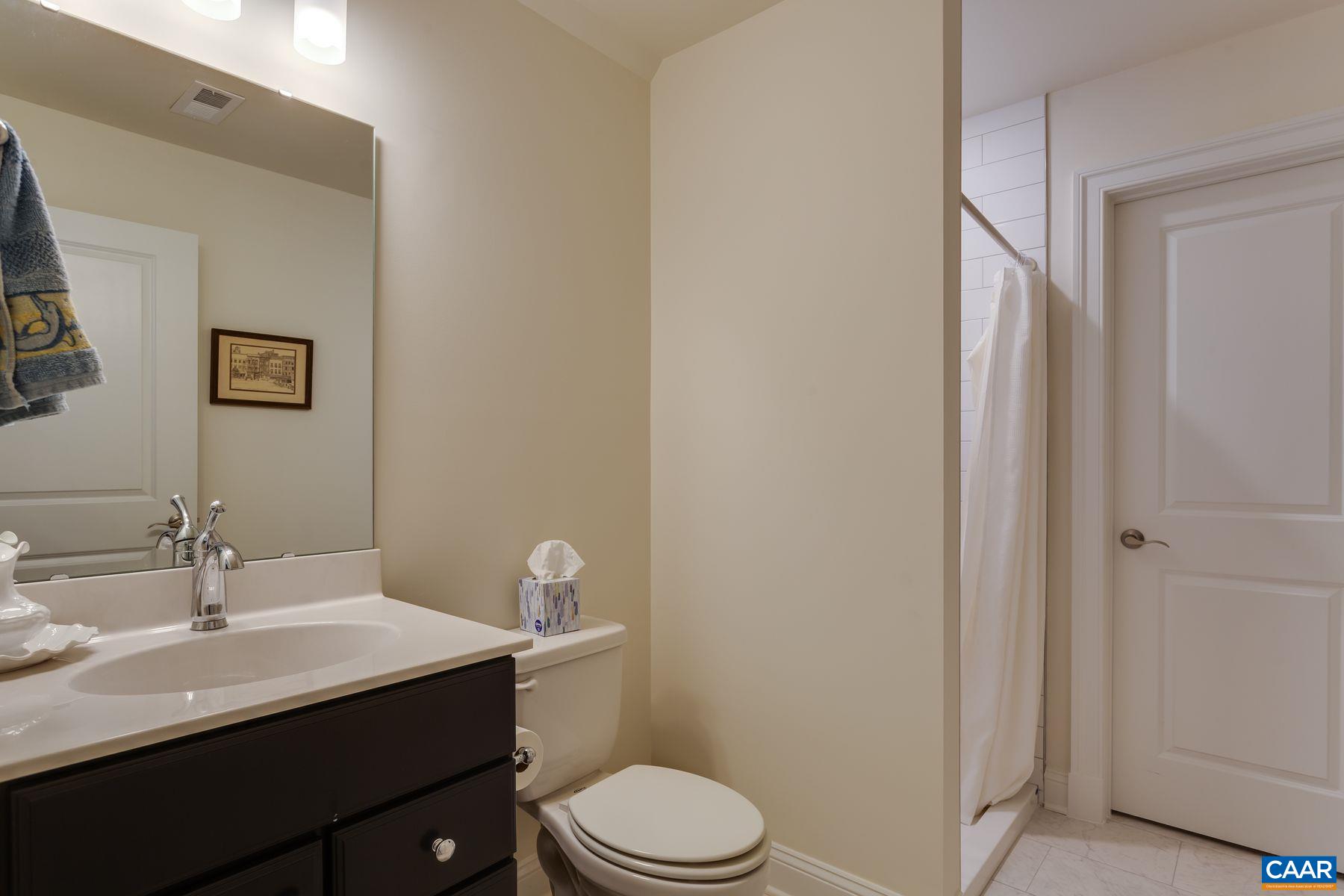 1927 Fowler Street Charlottesville, VA 22901 - Photo 25 of 36 a bathroom with a sink vanity mirror and toilet