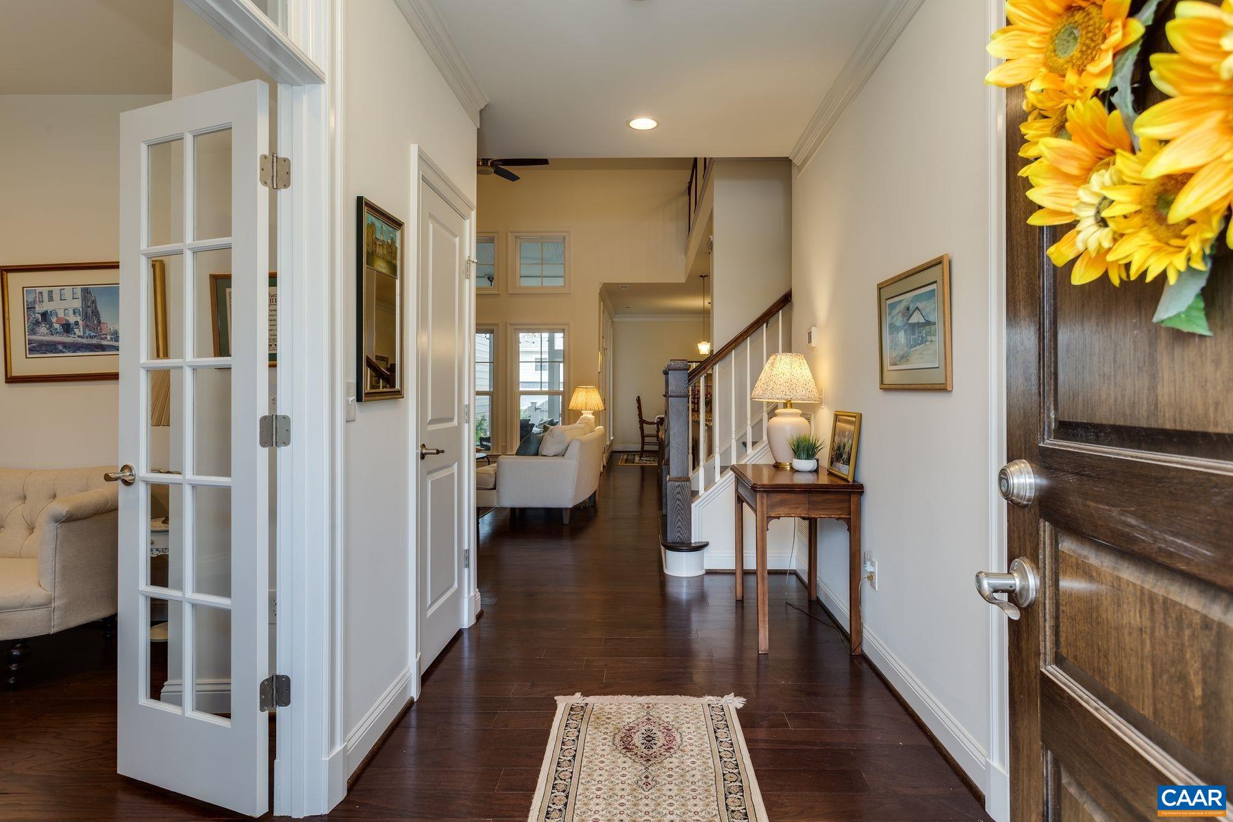 1927 Fowler Street Charlottesville, VA 22901 - Photo 6 of 36 a view of a hallway view with wooden floor and staircase
