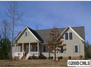 a front view of a house with garage