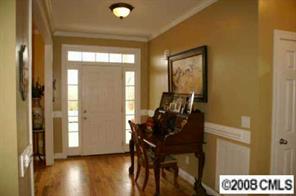 2044 Roadrunner Road Clover, SC 29710 - Photo 5 of 7 a view of a workspace room with wooden floor and windows