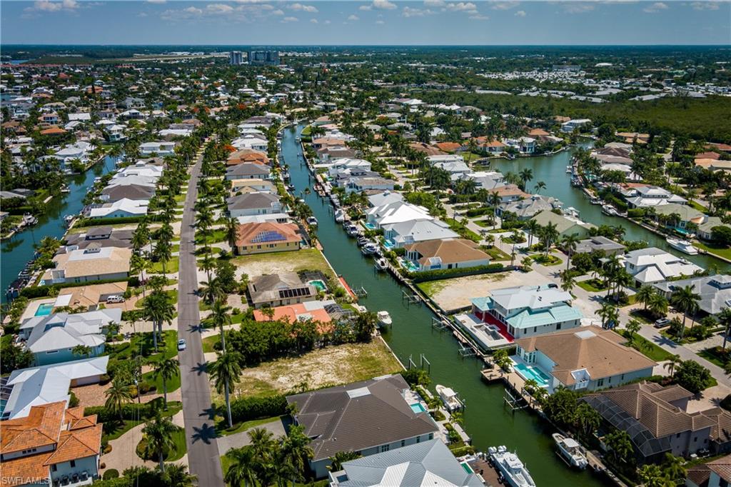 2165 Tarpon Road Naples, FL 34102 - Photo 19 of 24 an aerial view of residential houses with outdoor space