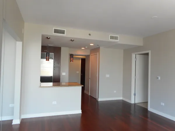 a kitchen with a stove a microwave and cabinets