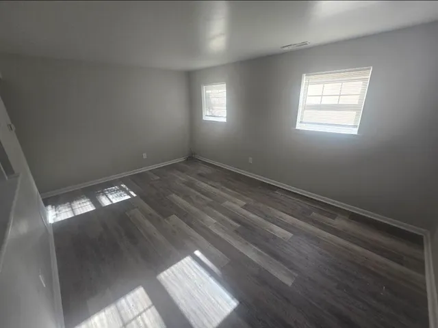 en empty room with windows