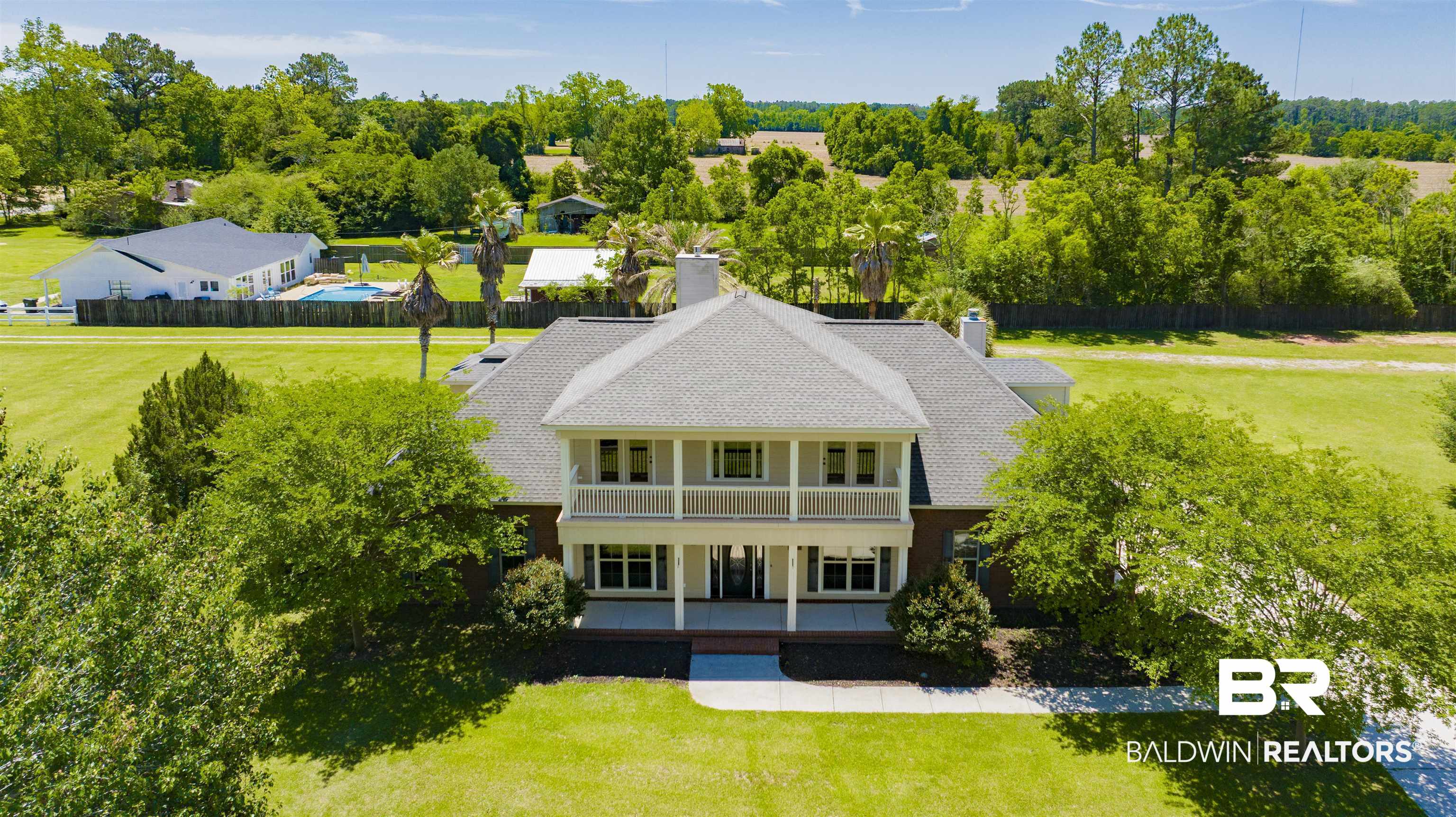 12944 Anna's Way Stapleton, AL 36578 - Photo 2 of 64 Two-story traditional residence with a brick facade and a light gray shingle roof