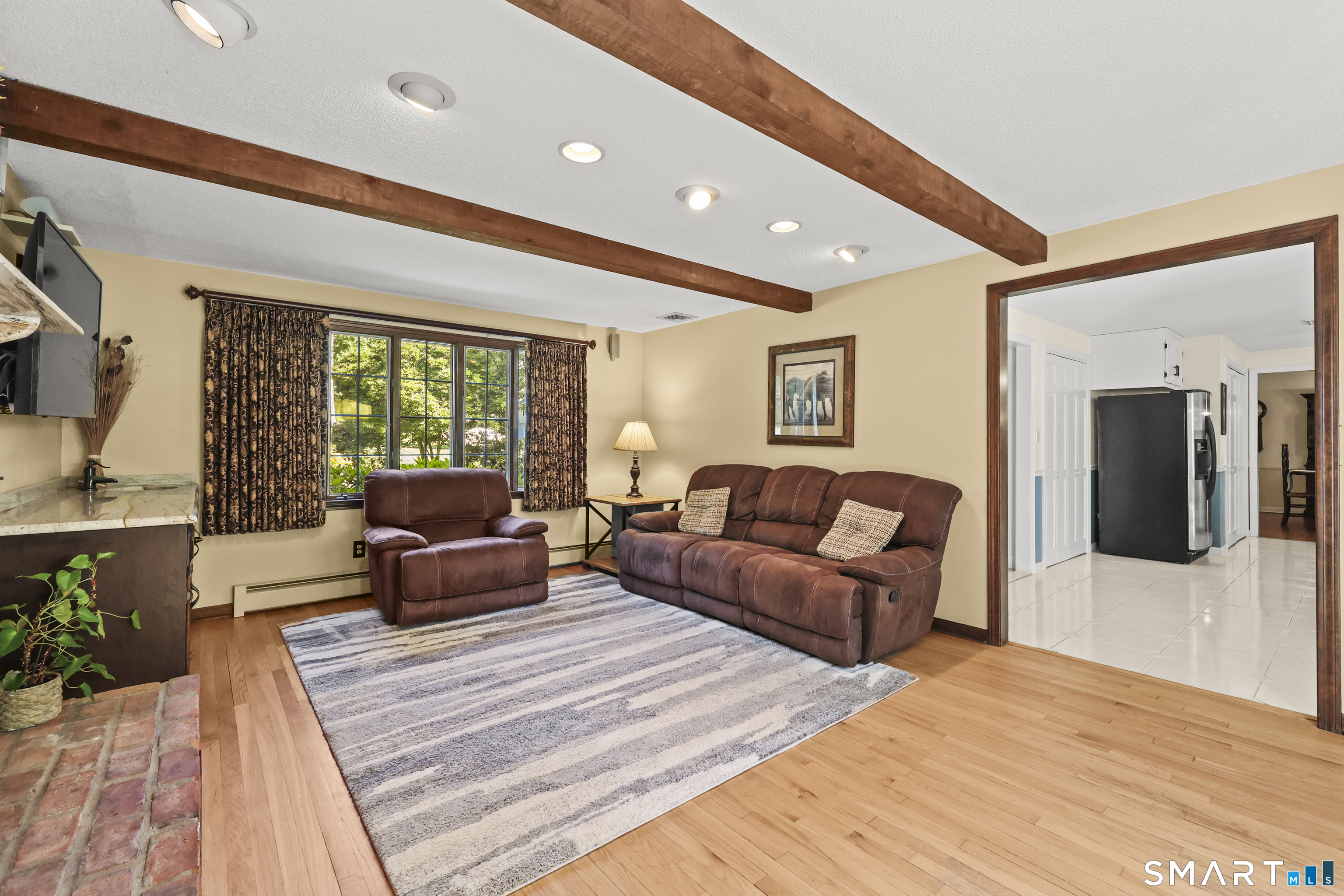 17 Briar Hill Road Avon, CT 06001 - Photo 27 of 38 This family room feature views to the front and back of the house and open to the kitchen and deck.