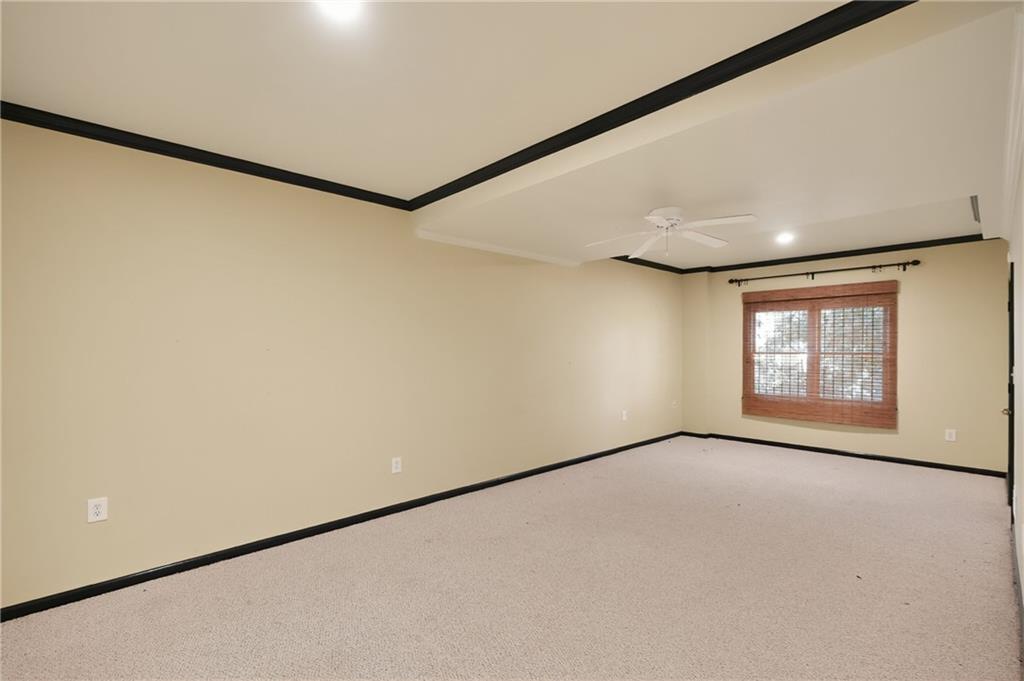 10950 Regal Forest Drive Suwanee, GA 30024 - Photo 13 of 52 a view of an empty room with a window